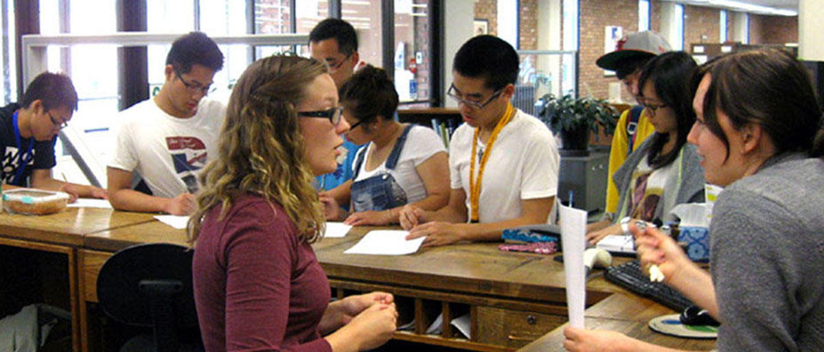 Library staff helping students at the Circulation Desk