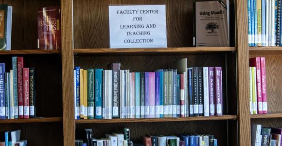Books from the Faculty Collection on shelves